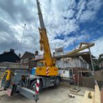 Mobile crane lifting Roof Trusses