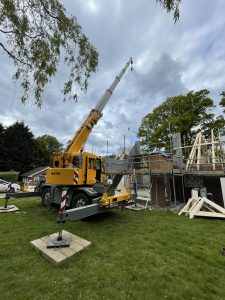 Mobile crane lifting Roof Trusses