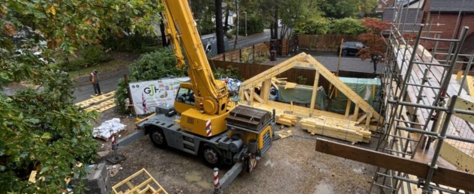 Mobile crane lifting components for a timber framed house